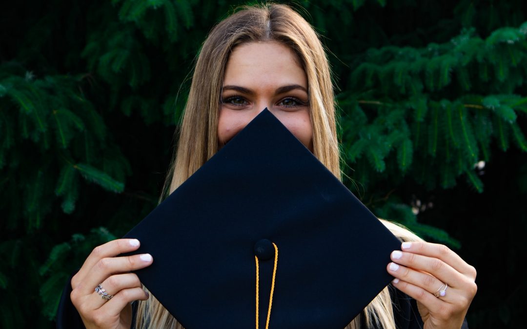 College student holding a graduation cap