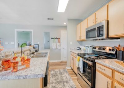 example kitchen with stainless steel appliances at the quad apartments